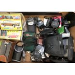A collection of 20th Century cameras all cased with accessories