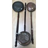 Three various 19th Century bed pans, wooden handles