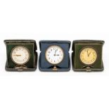 Three leather cased travel clocks, the eight day 'pocket watch' movements in square cases, 10.5cm (