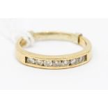 A 9ct gold diamond set dress ring, set with seven faceted stones, ring size Q, 2.83 grams approx