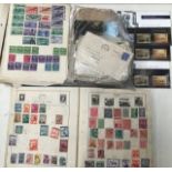 A collection of assorted stamps and cigarette cards (two bags)