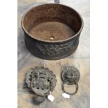 A 19th century cast iron garden planter of circular design with floral decoration together with a