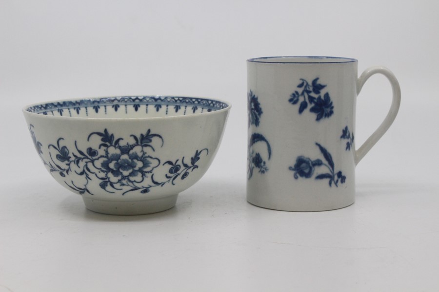 A Worcester mug, circa 1770-85, of cylindrical form with ribbed strap handle, printed in blue with