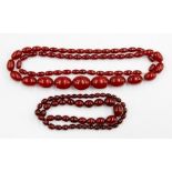 A string of graduated cherry amber style beads, gross weight approx 80gms; another small, approx
