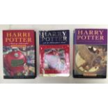 Three (3) Harry Potter books, one (1) printed in Welsh.