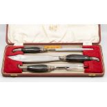 A George Butler, Sheffield, buffalo horn handled carving set, cased