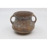 A Chinese painted pottery jar, Neolithic, of bellied form with twin strap handles, painted in