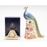 Royal Crown Derby Imari peacock paperweights, along with a miniature desk clock