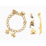 A 9ct fancy curb link padlock bracelet suspending three 9ct pig charms, weight approx 12.5g,