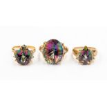 Three contemporary dress rings, two 9ct gold mystic and white topaz rings, and a 9ct gold rainbow
