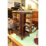 An Edwardian rotating bookcase, circa 1910, Height 82cm , width 46cm square form.  Condition Report: