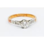 A diamond and 18ct gold solitaire ring, claw set brilliant cut diamond of approx 0.60ct with diamond