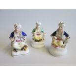 Three Staffordshire Figures of Seated Turks Date  circa  1860 Size   12cm  13cm  13.5cm  high