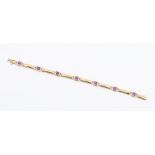 A 9ct gold and amethyst line bracelet, set with seven square-cut stones, total gross weight approx