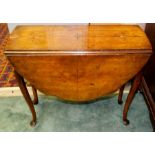 An early 20th Century walnut Sutherland table, circa 1915, raised on cabriole legs with pad feet,