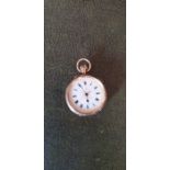A 15ct yellow gold open faced pocket watch, white enamel dial with applied gilt foliate
