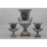 A matched garniture of Herend Porcelain vases, of campana form and decorated with birds in