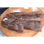 A brown ladies fur coat