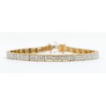 A 9ct gold articulated diamond set bracelet, comprising rectangular links pave set with small