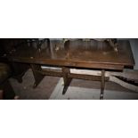 ***OBJECT LOCATION BISHTON HALL*** A large oak dining table, raised on a trestle type base.
