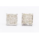 A pair of 9k white gold and diamond Tomas Rae earrings, set with eighteen square-cut diamonds, total