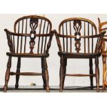 Two mid 19th Century Windsor chairs, comprising one in yew with an elm seat, measuring 91cm high;