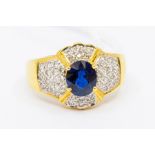 A sapphire and diamond cluster ring, set in unmarked yellow metal assessed as 18k gold, size P1/2,