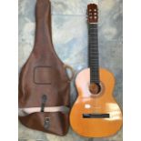 A Spanish acoustic guitar, complete with original carry case