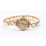 A Rotary 9ct gold ladies wristwatch, round champagne dial, dot and number markers, case diameter
