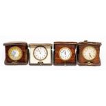 Three crocodile cased travel clocks, with Swiss eight day 'pocket watch' movements in tan square