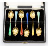 A set of six Elizabeth silver gilt and enamelled coffee spoons, with different coloured