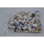 Thimbles: a large collection of assorted thimbles, including transfer printed thimbles, including