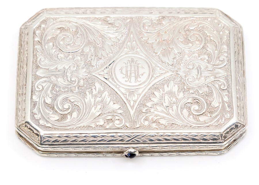 A Continental 800 standard silver compact, hexagonal form with scroll and foliate decoration,