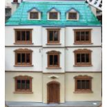 A handmade dolls house in the form of a Georgian town house, mid-20th century, three-hinged opening,
