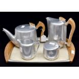 A 1960s Picquet stainless steel tea and coffee service, comprising tray, teapot, coffee pot, milk