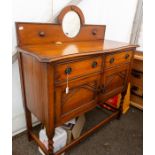 A 1920s oak sideboard, fitted with two drawers over two doors, barley twist legs measuring 105cm