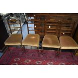 A set of four Edwardian rosewood parlour chairs, inlaid backs, spindle gallery turned backs, each