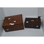 A mahogany inlaid Victorian writing scope with ink bottle and key along with rosewood tea caddy