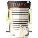 A modern Timex watch wall hanging display cabinet
