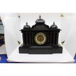 A late 19th century slate mantle clock, Eight day movement, the face with a chapter dial and