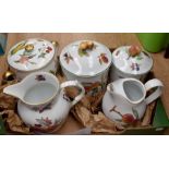 A Royal Worcester Evesham part dinner service comprising jug, biscuit barrel, teapot, condiments,