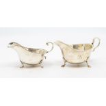 A George V silver sauce boat with egg-and-dart border, thre shell and trefid feet, by Mappin & Webb,