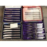 A collection of three cased silver fruit knife sets (one incomplete and damaged) all Sheffield