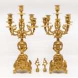 A Rococo style brass garniture clock set, comprising an eight day mantle clock and a pair of four