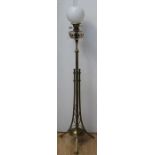 An Arts and Crafts brass standard oil lamp, with cut glass reservoir, opaline glass shade, clear