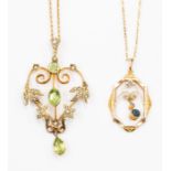 An Edwardian peridot and 9ct gold pendant, open work details set with seed pearls on a fine link