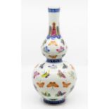 A Chinese double gourd vase, 19th Century, hand painted with dragonfly decoration throughout, on a