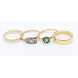 An 18ct gold and diamond three-stone ring, size M1/2, gross weight approx 1.7gms; an 18ct gold