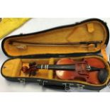 Violin by Suzuki. 8 1/4inch back with bow and case.