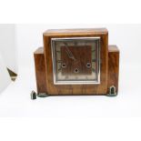 An Art Deco oak eight day mantle clock with Westminster chime, applied with a silver mount dated